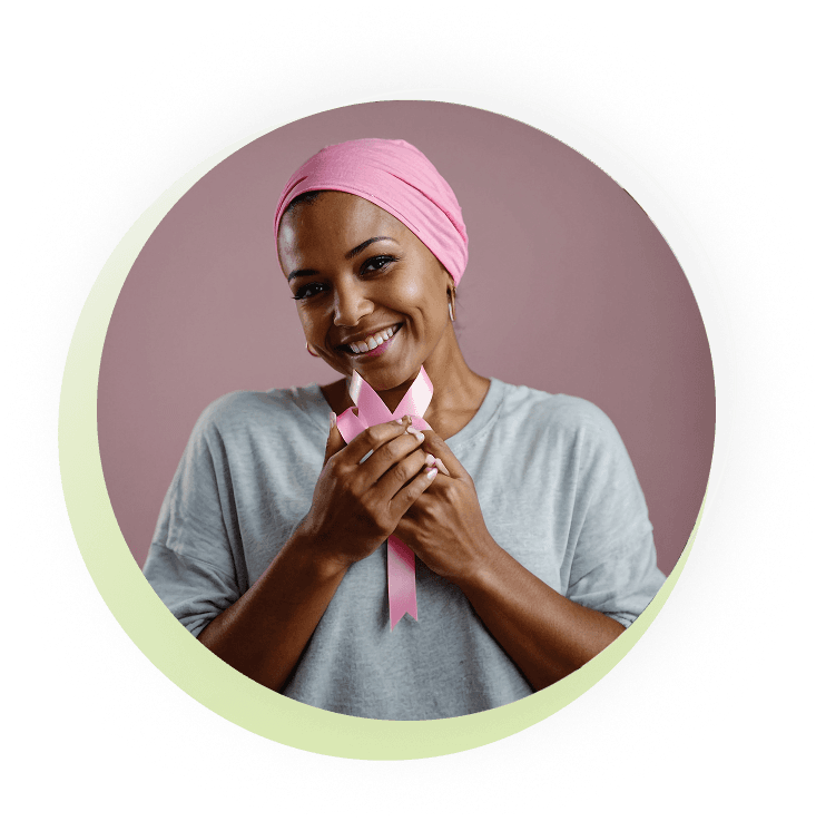 Woman holding a pink breast cancer awareness ribbon